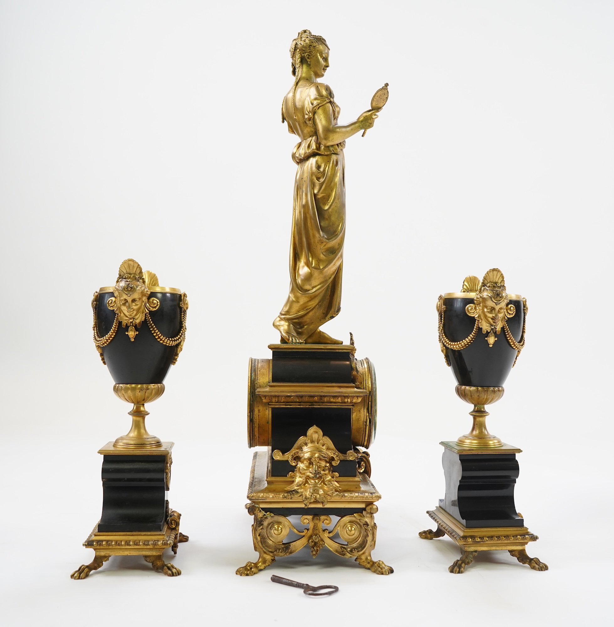 A French gilt bronze figural clock garniture, late 19th century